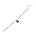 Bracelet double couche en acier doré avec perle cœur et pendentif camélia noir - Camélia