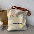 Detail of off-white canvas tote bag with brown straps and inspirational artwork - Long Way Go Anyway Beige