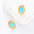 French style gold twisted oval earrings with blue enamel center on stone display - Gold / Sky Blue
