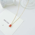 Elegant gold necklace featuring a rectangular red ruby pendant with minimalist fine chain - 14k Gold + Red Zirconia