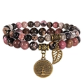 Close-up of triple-layer beaded bracelet with tree of life and leaf charms - Chinese Rhodochrosite