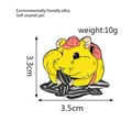 Detail showing the 3.5cm x 3.3cm dimensions of a cute enamel hamster brooch - Hamster Eating Seed