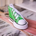 Mini high-top canvas shoe keychain in bright green with white rubber sole and laces - Green