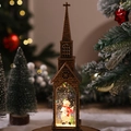 Détail d'une lanterne église vintage en bronze avec bonhomme de neige et LED chaude - Église à Eau Bonhomme de Neige