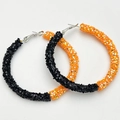 Detail of large hoop earrings with black and orange sequins in a basketball pattern - Black/Orange