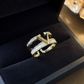 Macro detail of gold plated V-shape ring with rectangular zircon stones on velvet - Gold V-Shape Letter Rhinestone Style