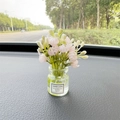 Car dashboard ornament featuring a clear glass flower vase with a pink floral bouquet - Pink Jasmine