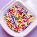 Pearlescent mixed color peanut shaped acrylic beads in a white tray for DIY jewelry - 200 Pieces/Pack (3*6mm) / Random Mixed Colors