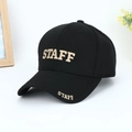Detailed close-up of white STAFF 3D embroidery on classic black baseball cap brim - Black with Gold Letters