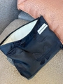 Large black canvas cosmetic bag with 3D bow texture and secure zipper closure - Black Bow