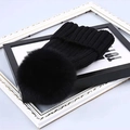 Chic black cable knit winter beanie featuring a large fluffy faux fur pom-pom detail - One Size / Black