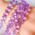 Faceted purple crystal heart-shaped beads on a bracelet with a polished finish - Crystal Purple