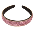 Sparkling pink rhinestone padded headband with black lining and gold trim detail - Pink