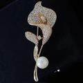 Elegant gold calla lily brooch with shimmering crystals and a white pearl accent - Calla Lily Pearl / Gold Pearl
