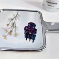 Mini acetate hair claw clip with colorful marble pattern displayed on mirror - Dark Purple Square