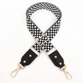 Adjustable black and white geometric woven bag strap with gold metal hooks and leather ends - Black