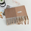 Plaid cashmere scarf with camel and grey blocks and elegant tassels in a flat lay - Khaki