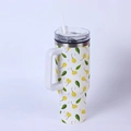 Close-up of 40oz insulated tumbler featuring fresh yellow flowers and green leaf patterns - Fresh Yellow Flowers/White