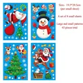 Detail view of 4-sheet Christmas window sticker set with 65 cartoon holiday decals - W Set (4 Sheets)