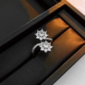 Detail of silver open ring with dual zircon flower clusters on black satin display - Silver Double Flower Wrap Style (9#)