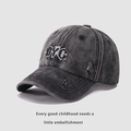 Close-up of distressed charcoal denim baseball cap with DYC embroidery and worn edges - Kids Size 54cm / Black