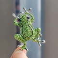 Macro shot of green rhinestone frog brooch with intricate silver metal details and crystals - Silver Base Emerald Green Full Rhinestone Frog