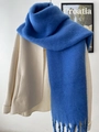 Blue mohair cashmere-like scarf with long fringe tassels paired with a beige coat - Sapphire Blue