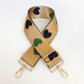 Detail of thickened jacquard nylon strap with colorful heart pattern and gold swivel hooks - No. 21 + Gold Hook (Khaki with Black/Green Heart)