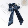 Close-up of a navy blue ribbed velvet bow scrunchie with long ribbons on a white background - Velvet / Long Ribbon Bow Style / Blue Gray