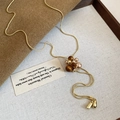 Detail of tiger eye beads and zircon snowflake pendant on a vintage golden snake chain necklace - Resin Pearl Gold Snake Chain Flower Necklace