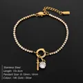 Elegant 14K gold plated stainless steel tennis bracelet with rhinestone letter T charm - Letter T