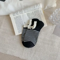 Women's low-cut boat socks featuring black and white stripes with a small heart label - Black