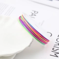 Colorful 72 nylon cord rolls for DIY jewelry making displayed on a ceramic plate - 10m / Colorful