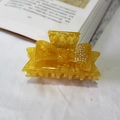 Amber textured acetate hair claw with rhinestone bow design and yellow finish - Yellow