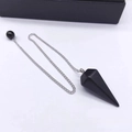 Black hexagonal crystal pendulum necklace with silver metal chain on white background - Obsidian