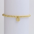 Detailed macro view of golden beaded bracelet with a polished initial letter I pendant - Letter I (DB240603-I)