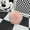 Close-up of pink plush winter beret showing soft faux fur texture and warm thick material - Pink