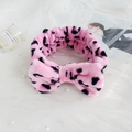 Pink plush headband with black spots and large bow for face washing and makeup - Pink Leopard