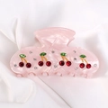 Pink acrylic claw clip featuring red rhinestone cherry motifs on silk background - Regular / Pink