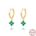 Macro detail of gold-plated S925 sterling silver earrings with green clover pendants - 925 Silver / Gold-Green Zirconia
