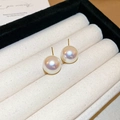 Close-up of elegant round iridescent pearl stud earrings in a luxury jewelry gift box - 5# Silver Earring Post - Gold - White - 14mm Pearl