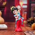 Tang dynasty female figurine in red and blue robes playing a musical instrument - Flower Drum Style