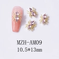 Macro view of golden spider nail charms with pink crystal rhinestones sized 10.5x13mm - Gold Base Pink Rhinestone (AM09)