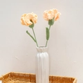 Handmade crochet light orange carnations in a white ceramic vase inside a woven basket - Carnation (Single Finished) / Yellow (Long Leaf)