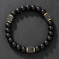 Detail of beaded bracelet featuring matte black beads with square volcanic lava stones - Square Lava Stone Gold Spacers (ZJ12327)