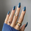Three gold rings featuring a white flower, colorful gems and a star pattern on blue sweater - Blue-Grey (JP2130)