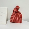 Red and white herringbone knit knot bag for women with minimalist styling and soft texture - Wave Red