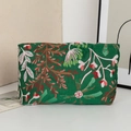 Detailed embroidery of red and pink flower buds on a forest green canvas cosmetic bag - Dark Green Floral Medium