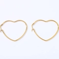 Detailed view of large gold heart-shaped hoop earrings in polished stainless steel - Heart (Gold)