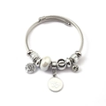 Silver charm bangle featuring tree of life and butterfly pendants on woven steel cord - Life Tree Butterfly (C1-018) / White